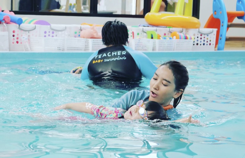 baby swimming school teacher