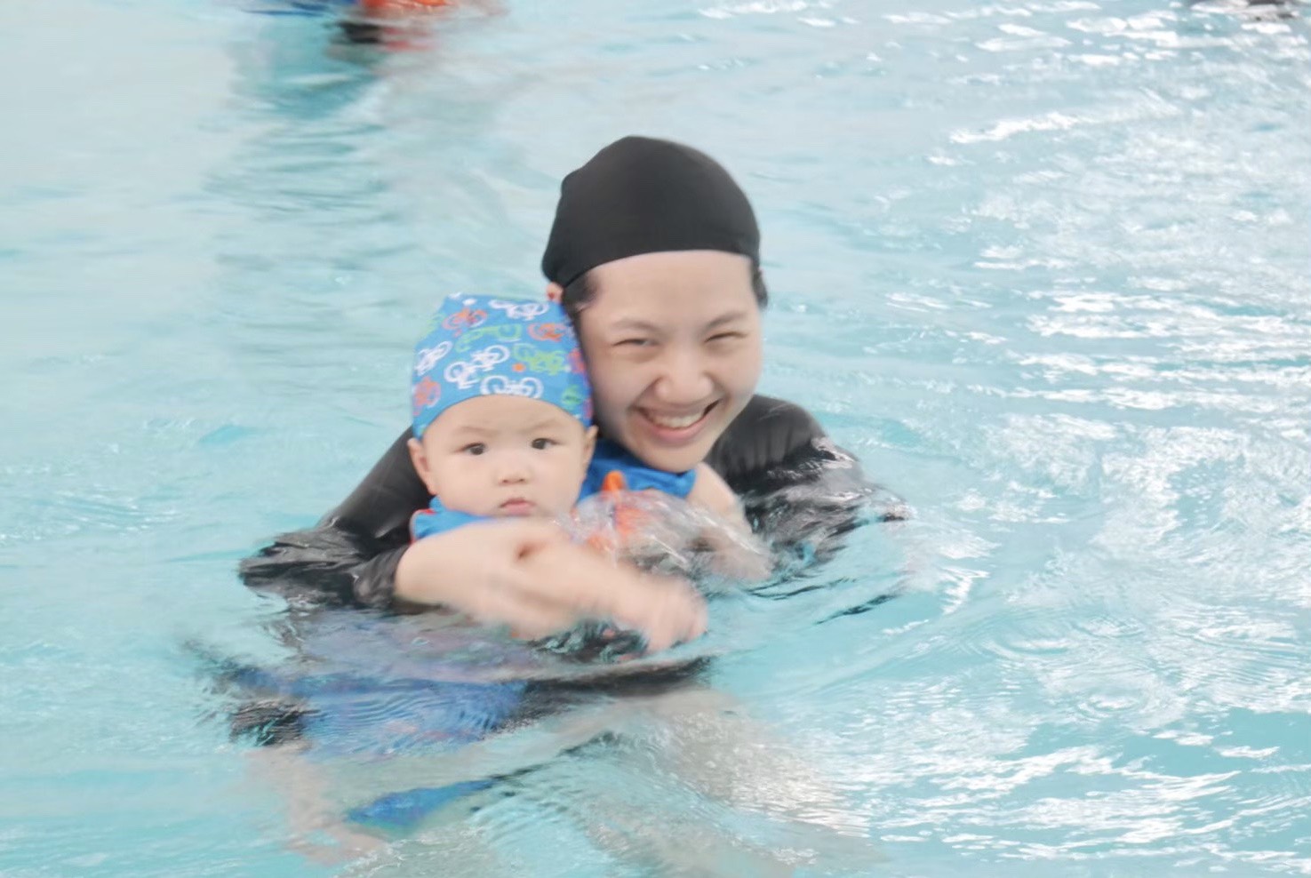 dad swimming with kid